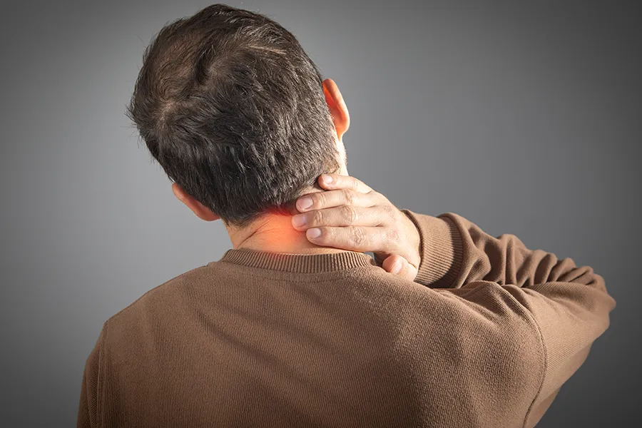 Chronic-Pain-Clinic A man massages his sore neck. Get chronic pain treatment from Dr. Stephanie King in Salt Lake City.
