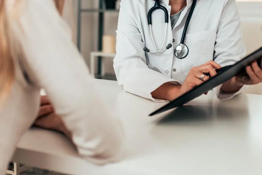 Functional-Medicine-Consultation-Clinic A clinician in consultation with a patient. Get a functional medicine consultation from Dr. Stephanie King in Salt Lake City.