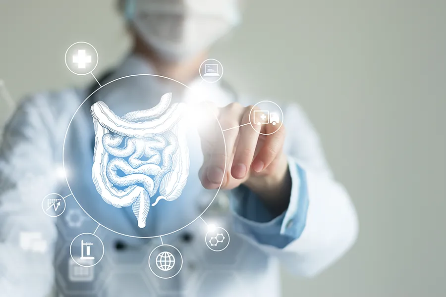 Leaky-Gut-Syndrome-Clinic Dr. Stephanie King provides advanced Functional Medicine for Leaky Gut Syndrome treatments in Salt Lake City, shown by a doctor touching a glowing digital intestinal health display.