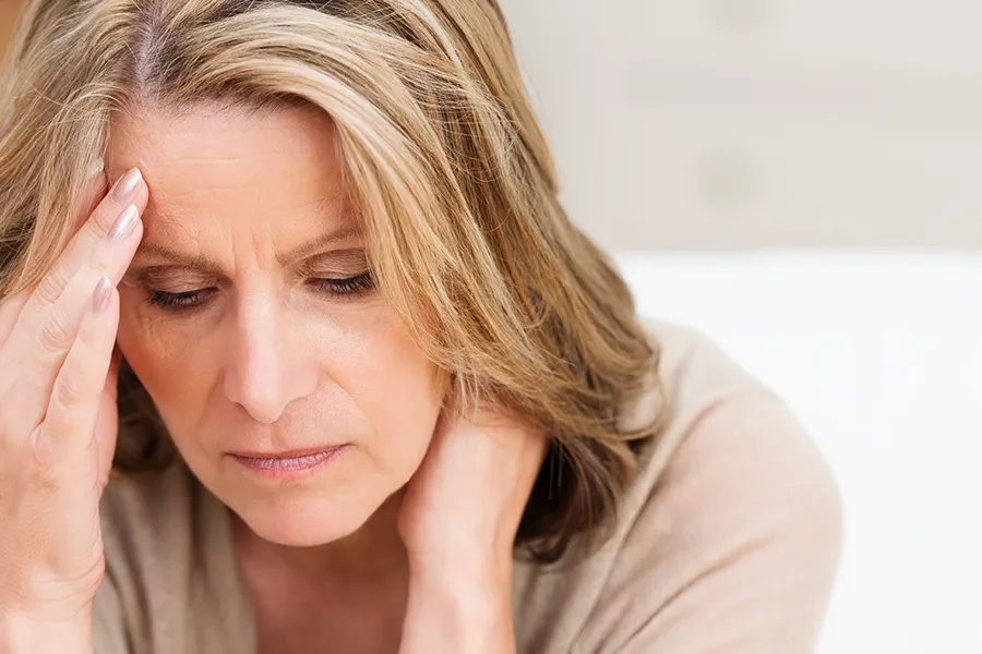 Mood-Imbalances-Clinic-2 A middle-aged woman sits in melancholy. Get treatment for mood imbalances from Dr. Stephanie King in Salt Lake City.