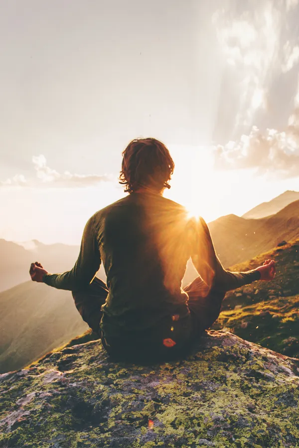 PTSD-Treatment A man meditating on a mountaintop. Get treatment for PTSD from Dr. Stephanie King in Salt Lake City.